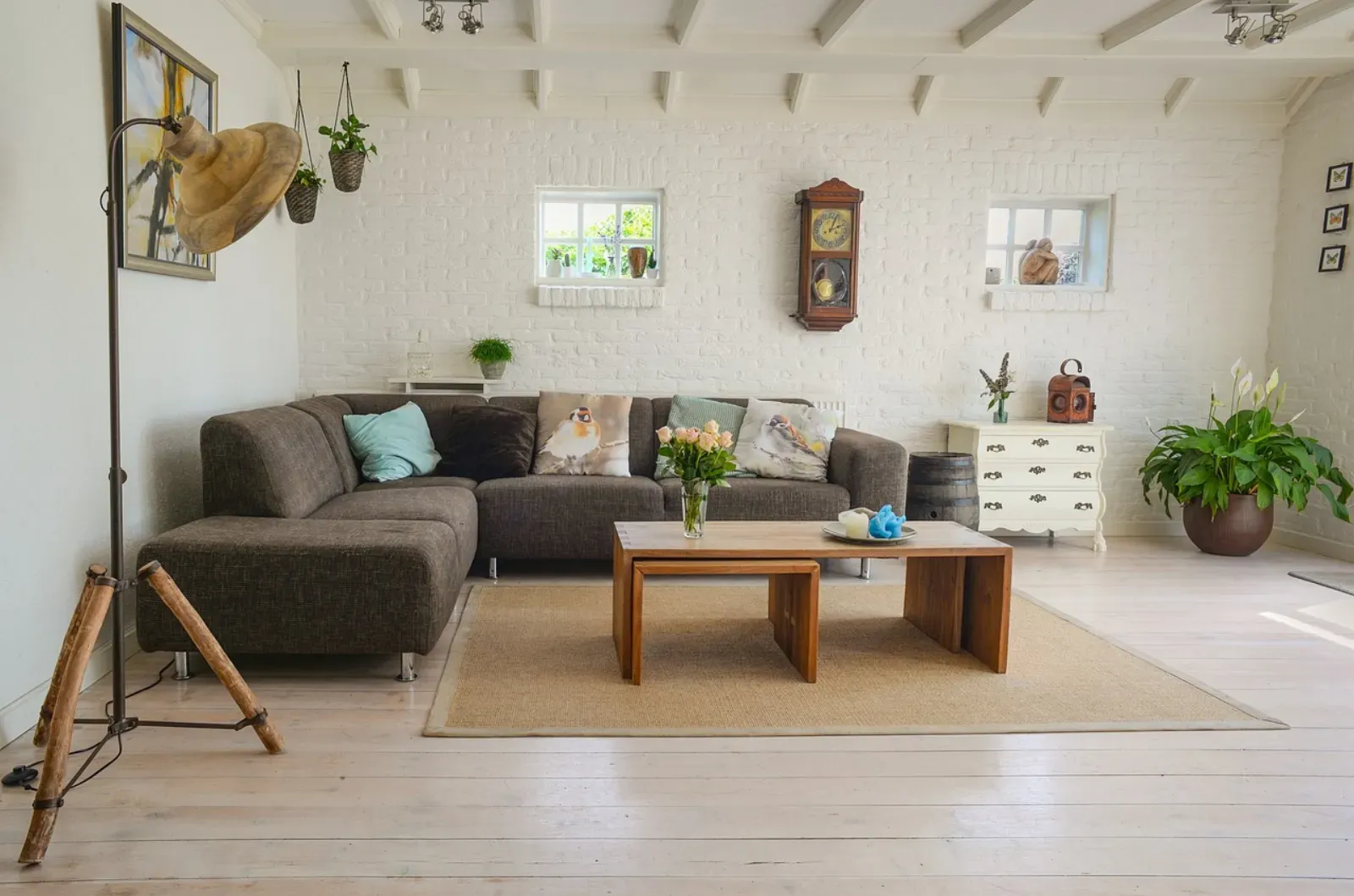 A styled Scandinavian interior with several wireless Huisio lamps casting a warm ambient glow